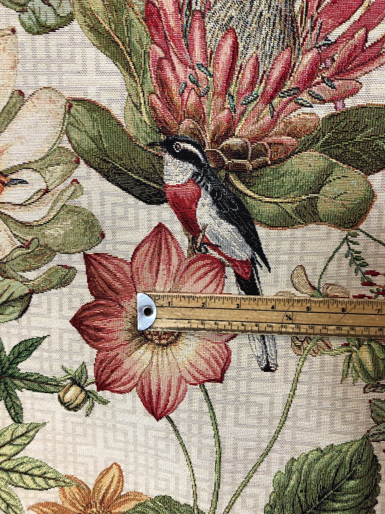 Nature-inspired bird and floral tapestry fabric.