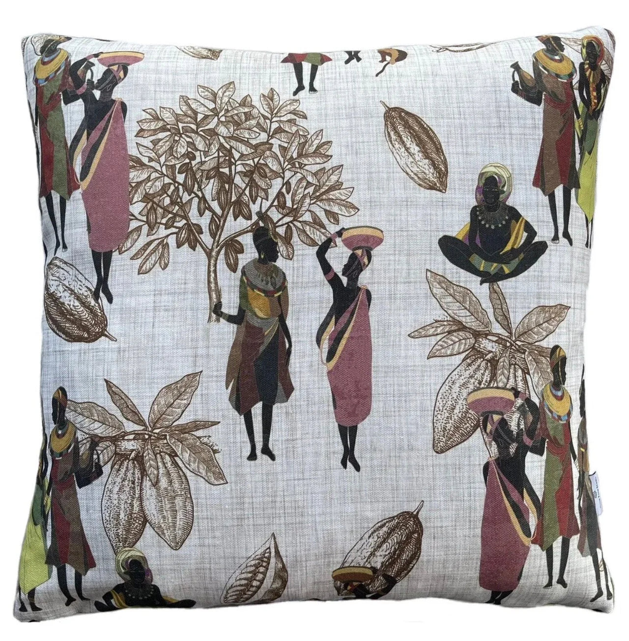 Decorative pillow with African-themed design featuring people and plants on a white background.