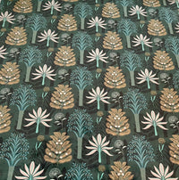 Thumbnail for Patterned fabric with stylized trees and plants on a dark green background