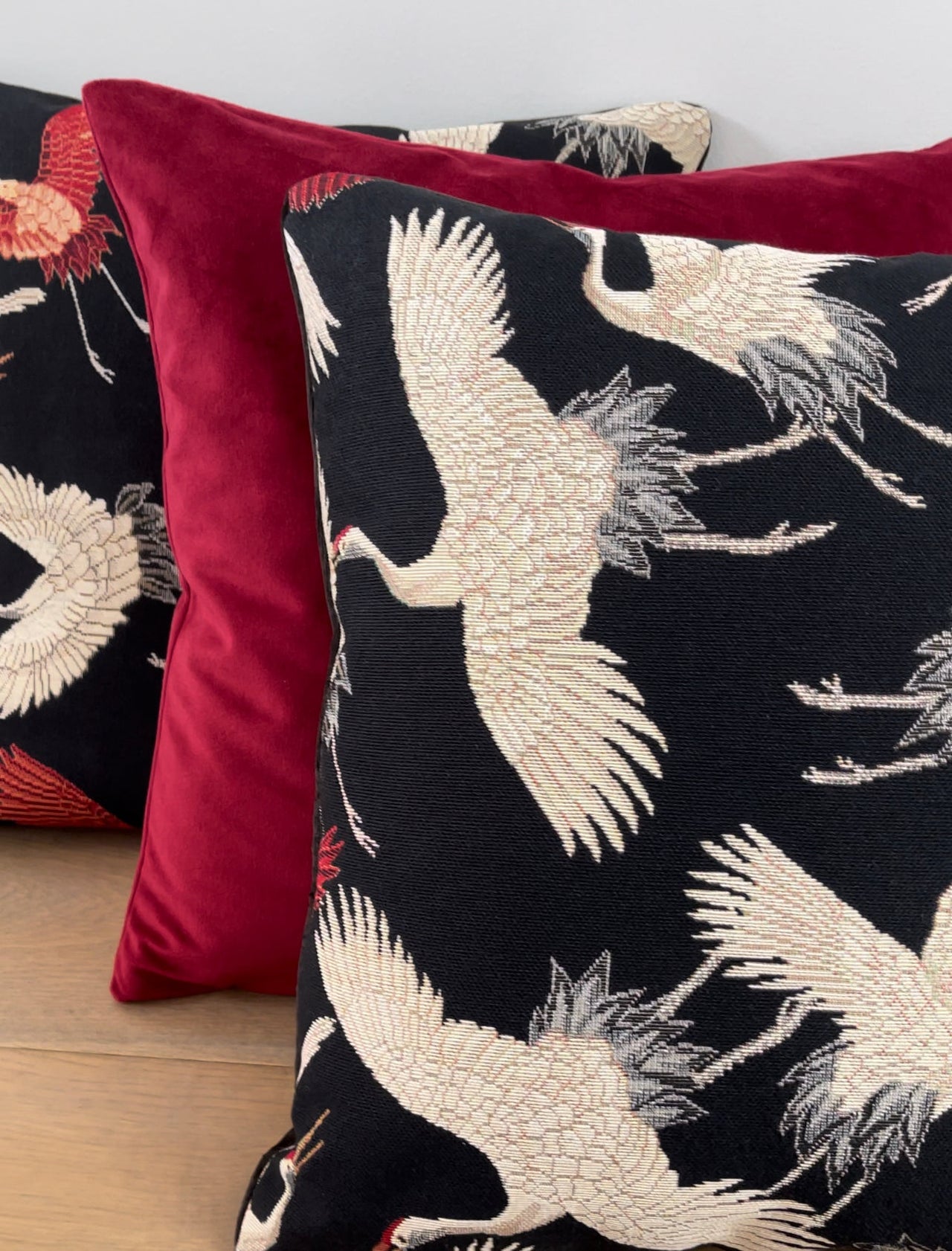 Minimalist cushion with Japanese crane design.