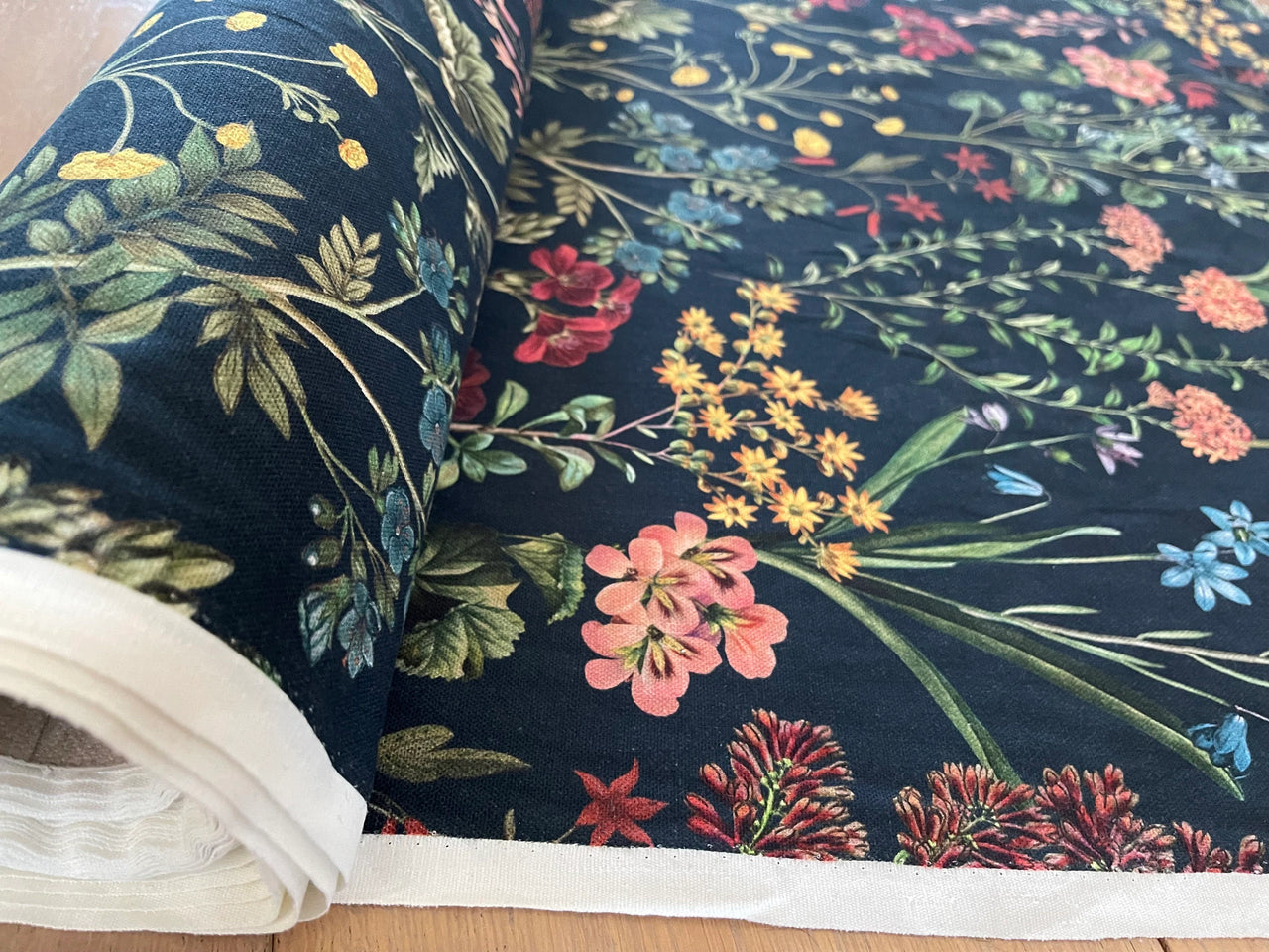 Floral fabric with colorful flowers on a dark blue background