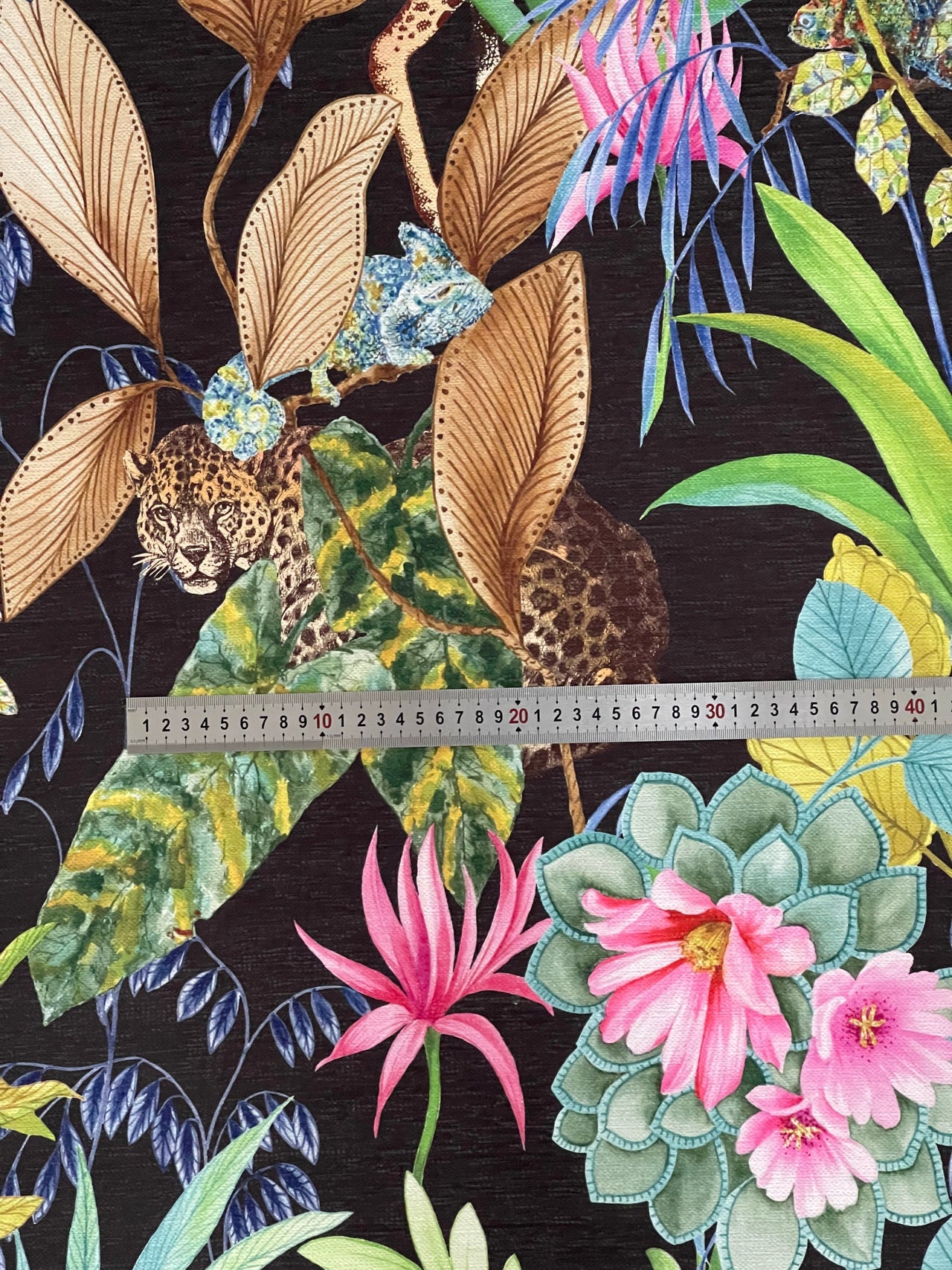Exotic jungle-themed fabric for sewing and crafts.