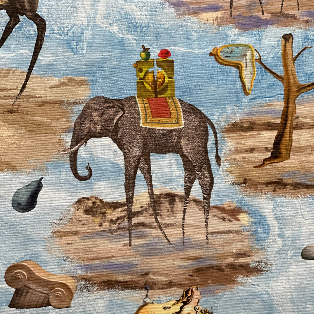 Full view of blue surrealist cotton furnishing fabric featuring elephants, camels, horses, melting clocks and imaginative desert landscapes.