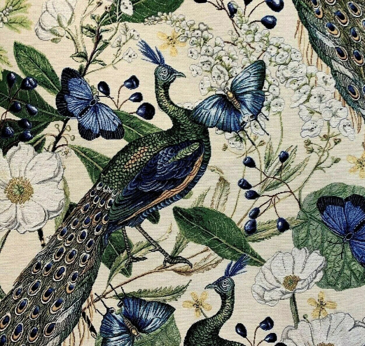 Decorative fabric with peacocks, butterflies, and flowers on a beige background