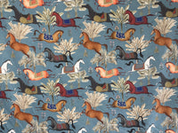 Thumbnail for Patterned fabric with horses and floral designs on a blue background