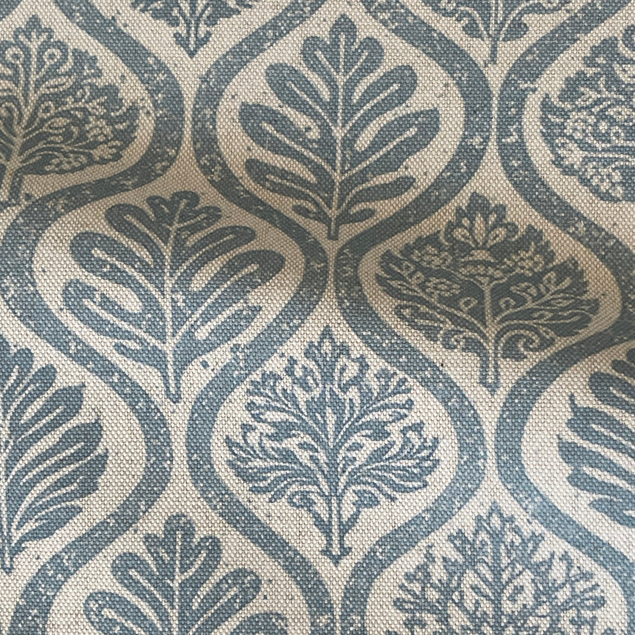 Soft denim blue botanical ogee fabric with Scandinavian folk leaf pattern
