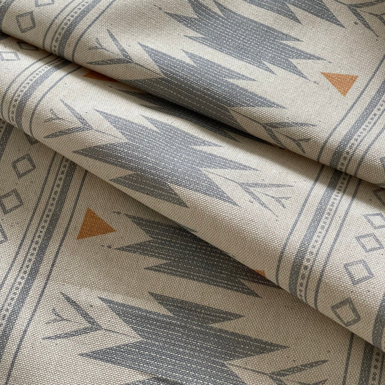Blue boho fabric with repeating Aztec geometric pattern
