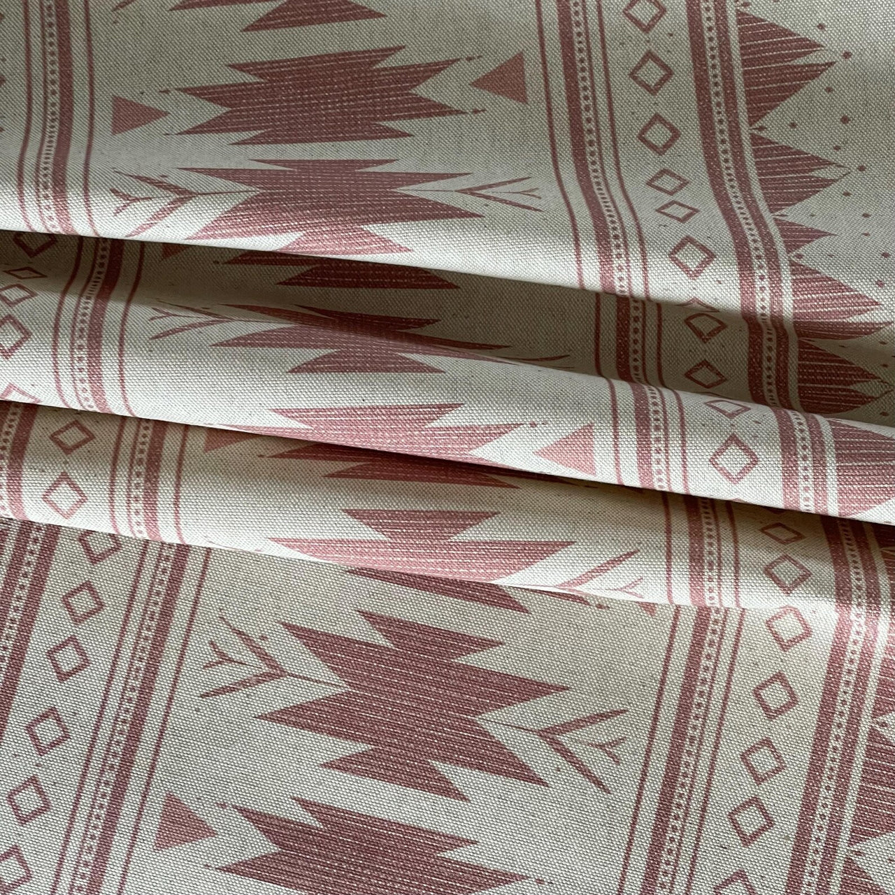 Blush pink geometric cotton fabric with tribal motifs for home decor
