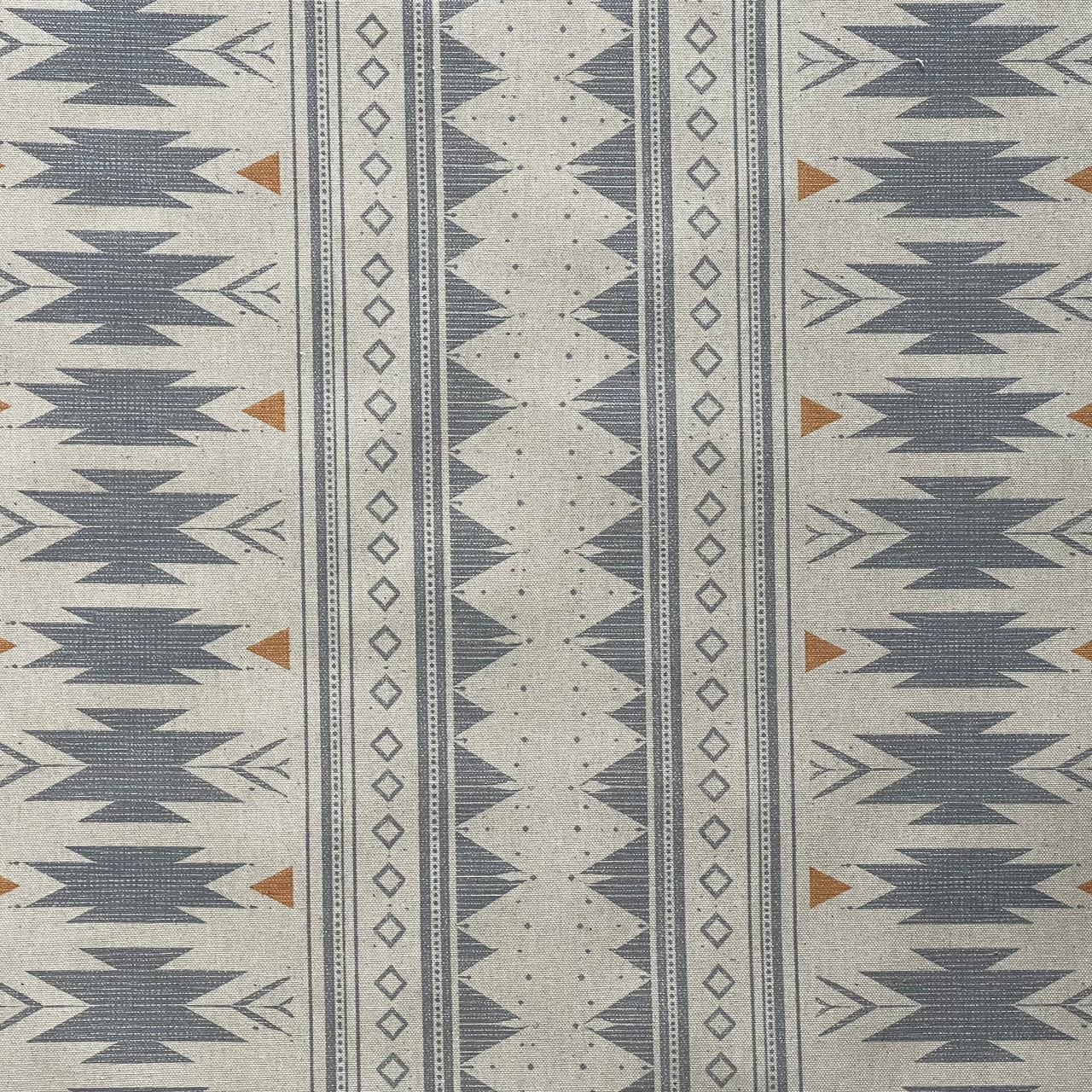 Blue linen look fabric with bold tribal motifs for home decor