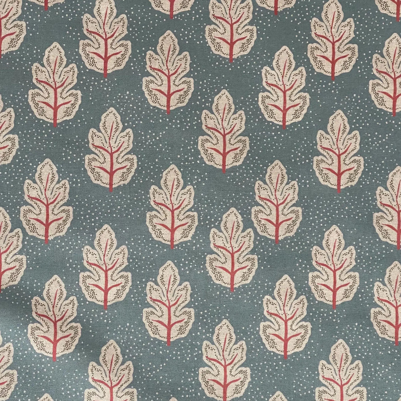 Nordic leaf print fabric with subtle dotted texture