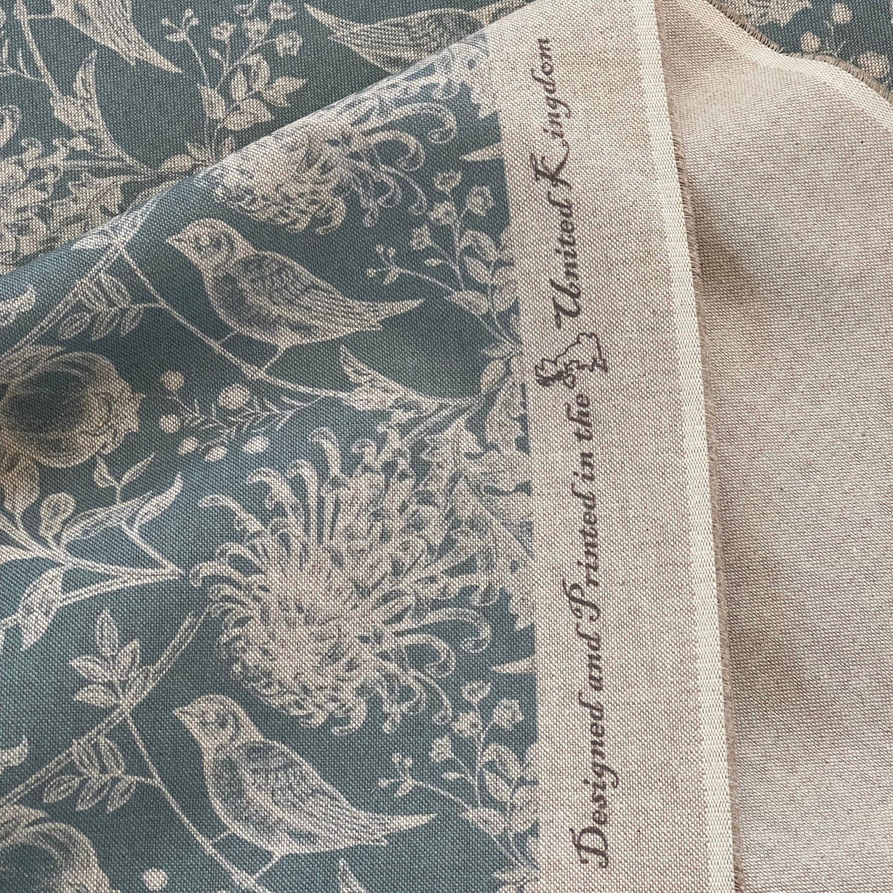 Soft blue floral fabric with birds