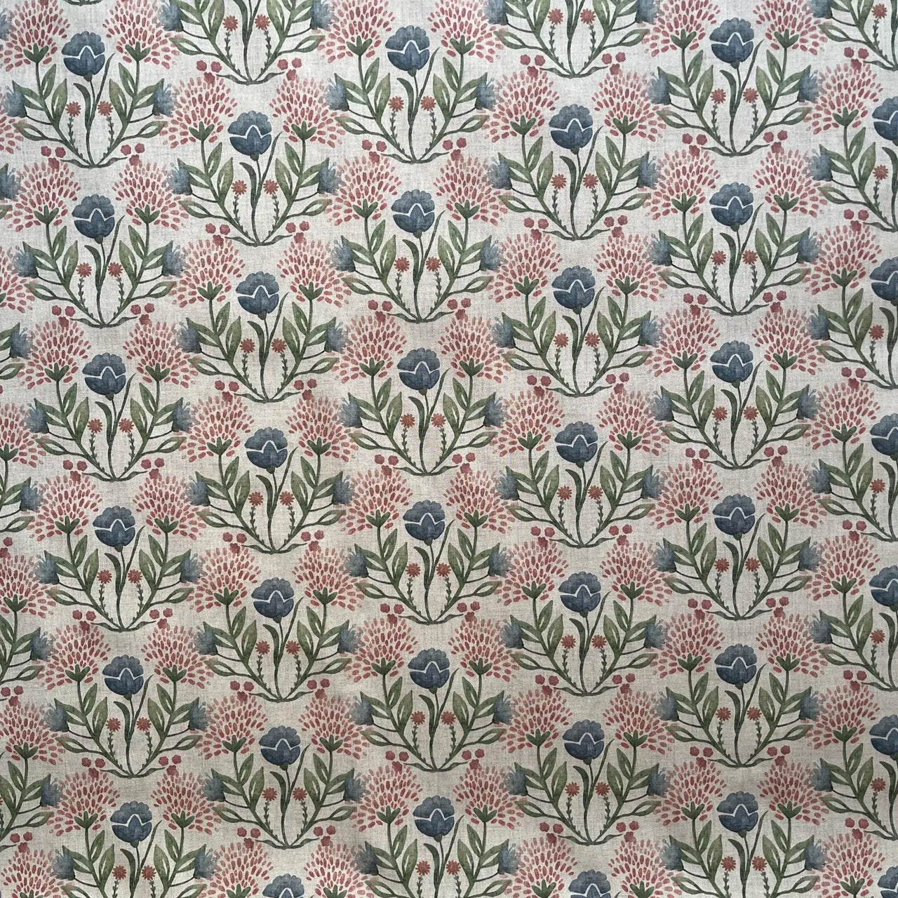 Patterned fabric with blue and pink flowers on a beige background
