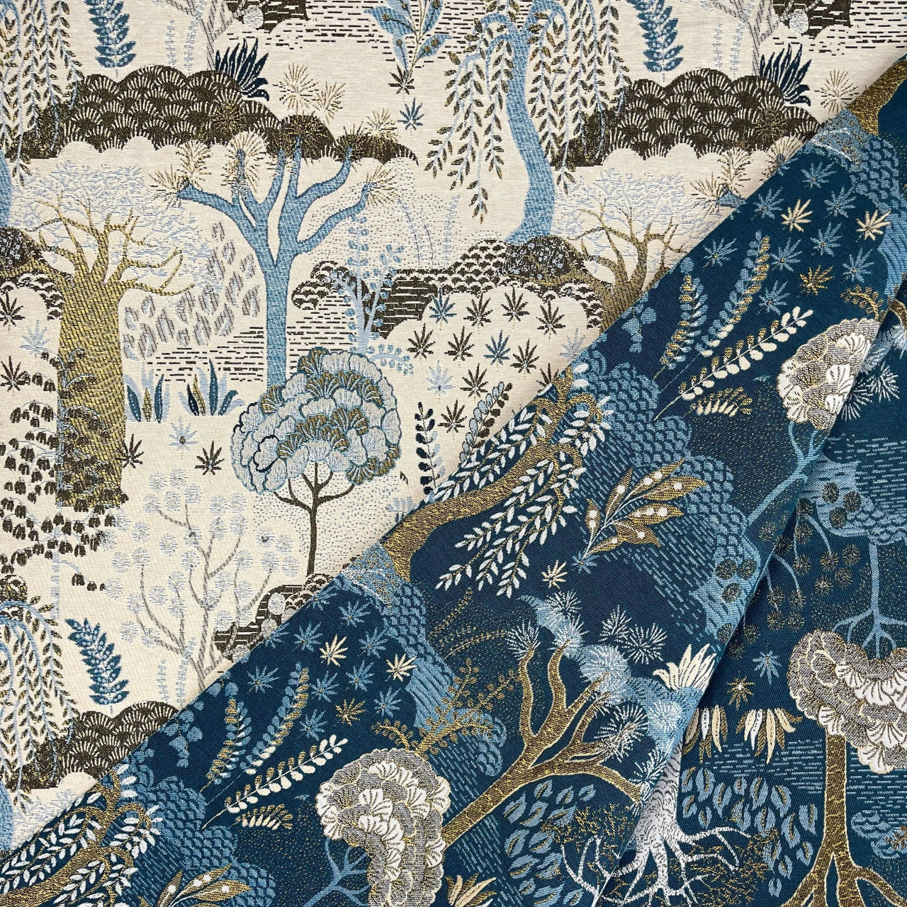 Double-sided Baobab Tree of Life fabric showing front and reverse pattern variations in blue and cream