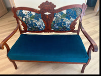 Thumbnail for Wooden bench with floral-patterned backrest and blue cushion on a wooden floor.