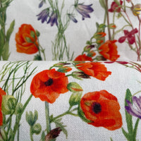 Thumbnail for Close-up of floral fabric with red poppies and green leaves on a white background