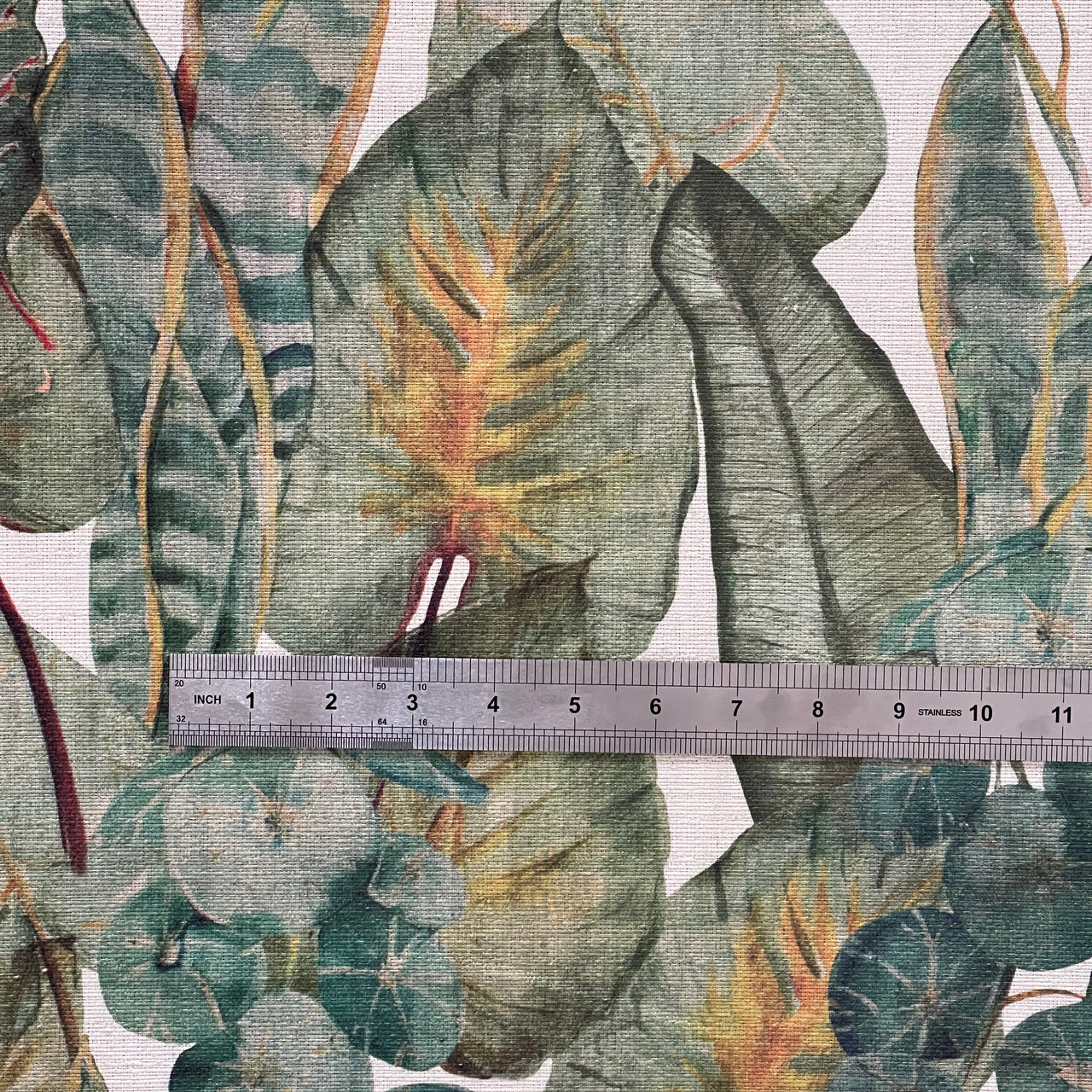Burnt orange and green leaf fabric sample

