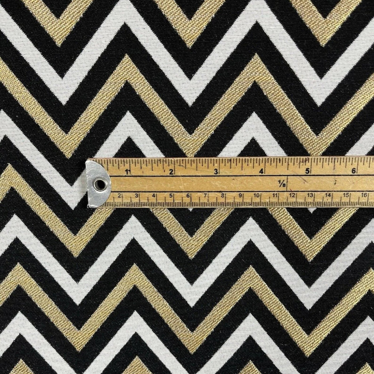 Textured chevron pattern fabric in gold.