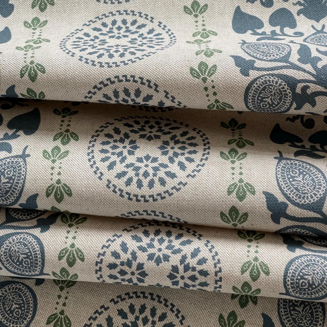 Upholstery fabric with navy botanical motifs and heritage medallion pattern