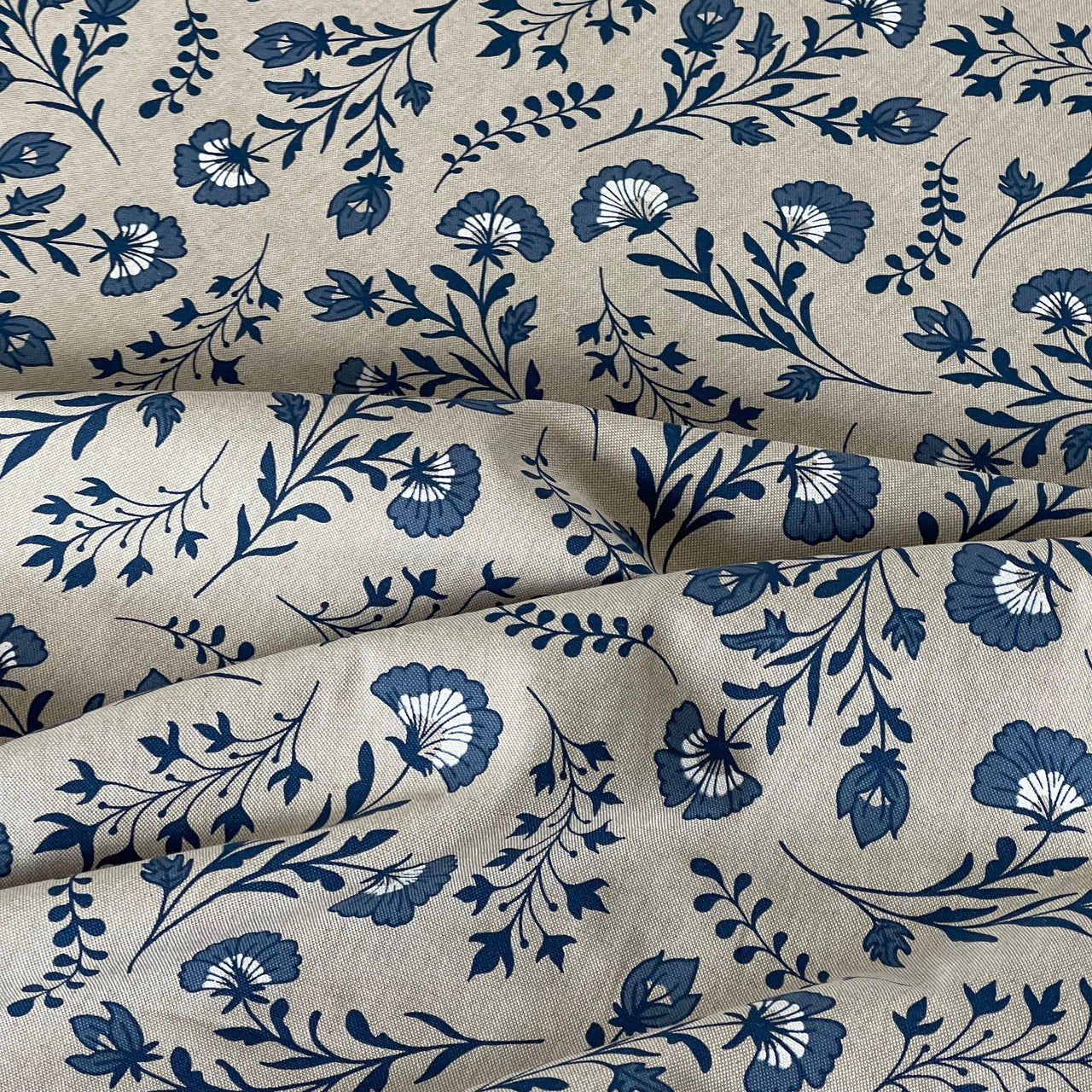 Navy floral vine pattern on natural textile

