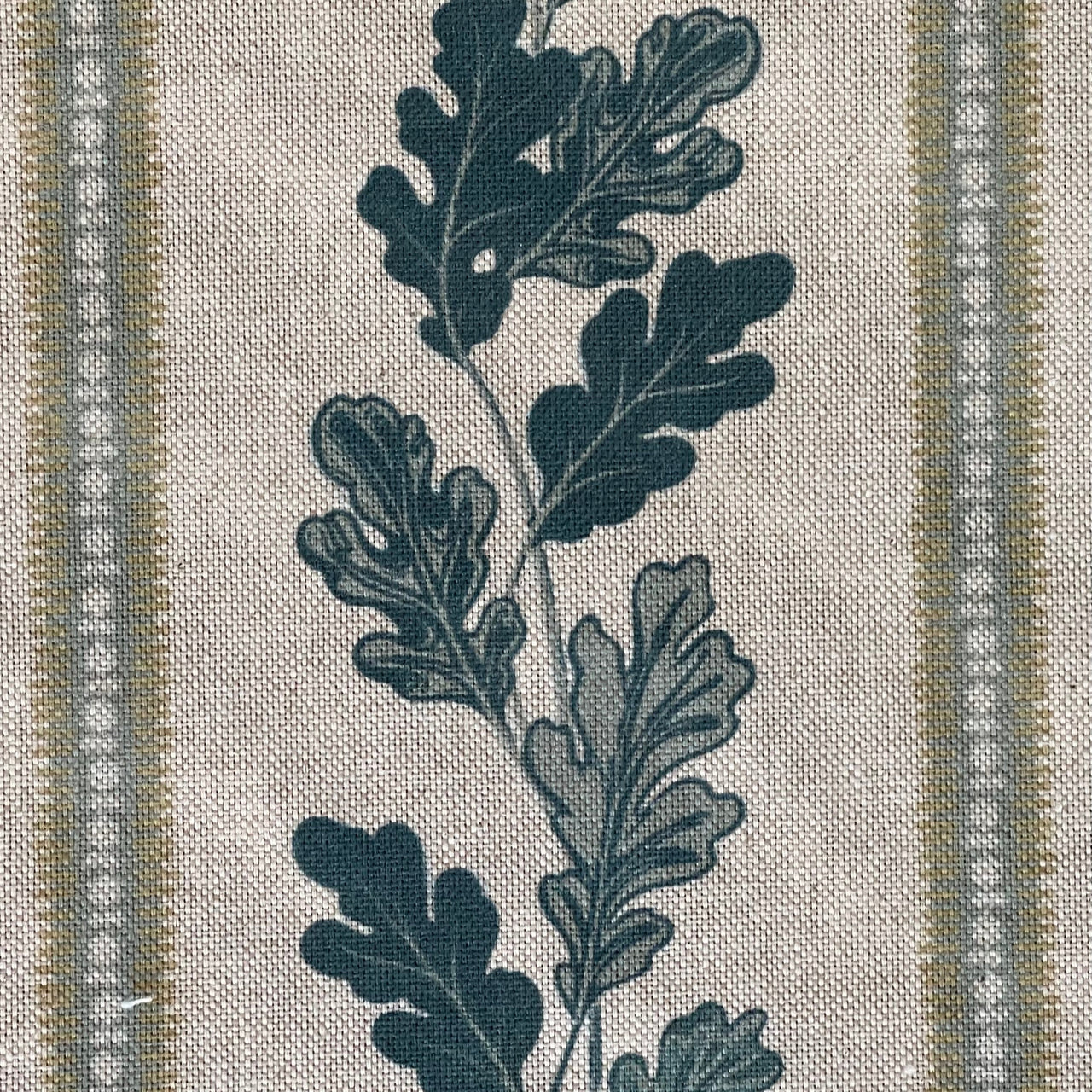 Indigo and green striped fabric with woodland theme pattern