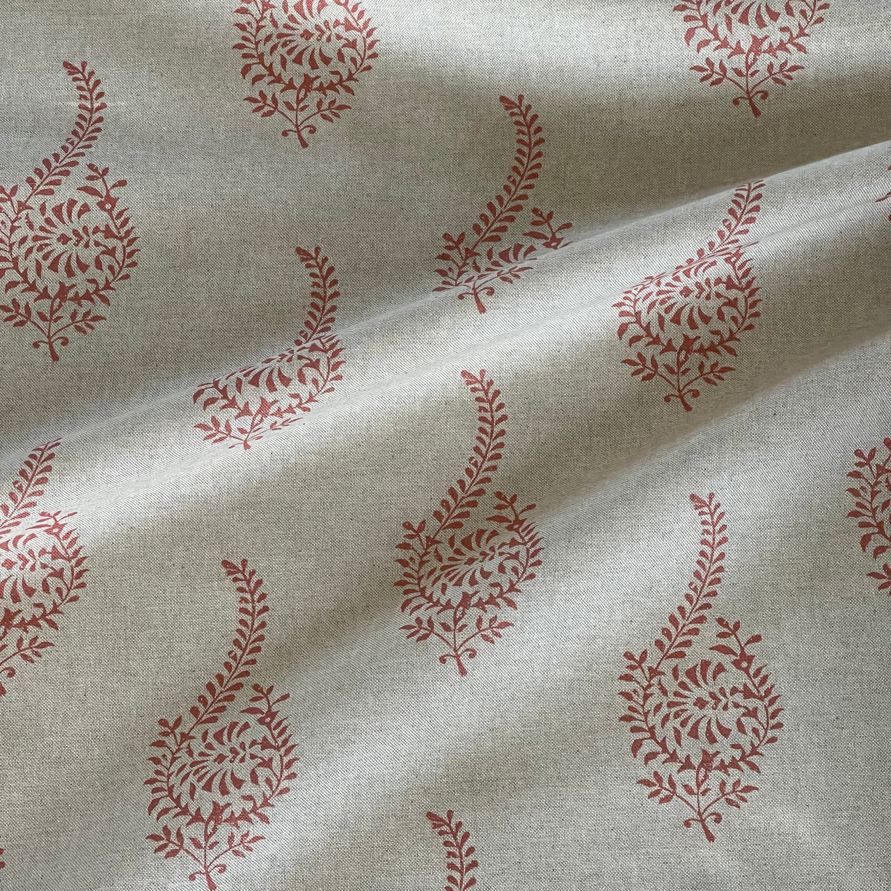 Traditional Indian coral paisley sprig fabric texture