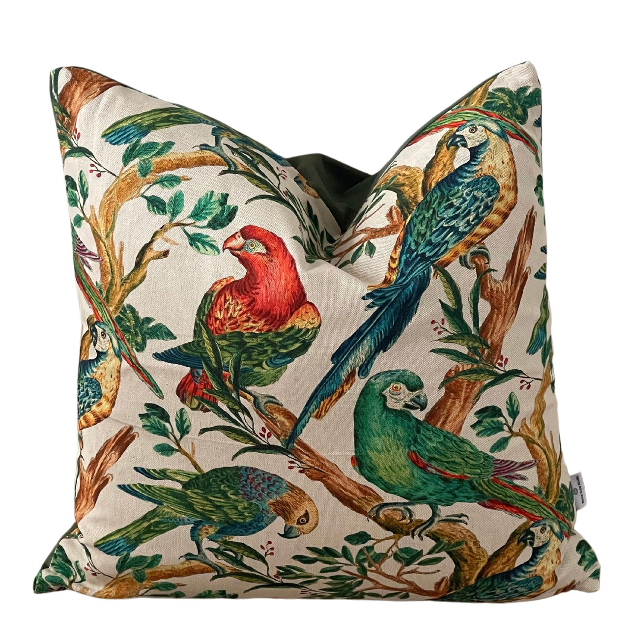 Handmade cushion with botanical parrot pattern.