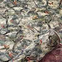 Thumbnail for Patterned fabric with birds and nature design on a beige background