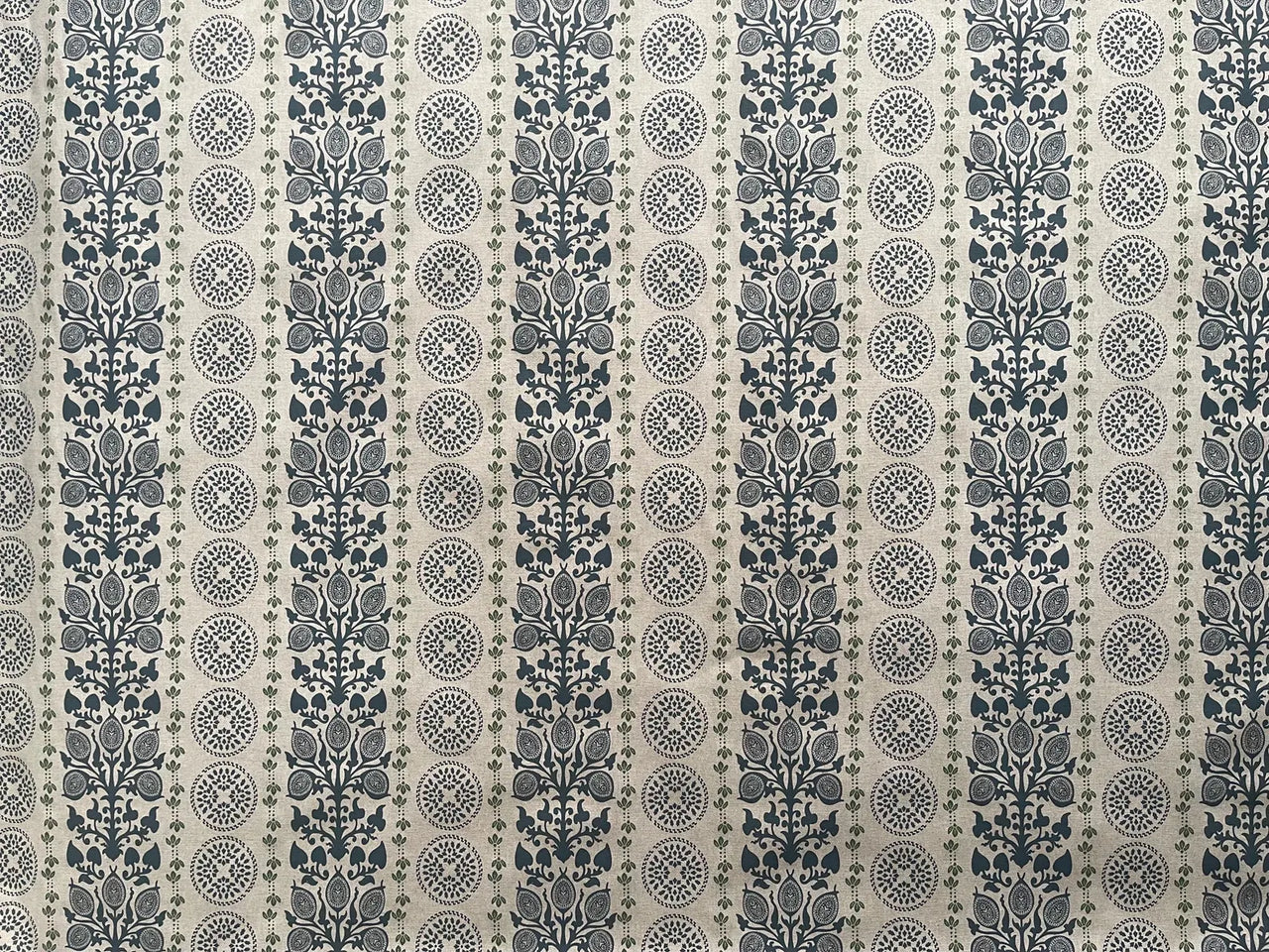 Traditional botanical medallion fabric in navy blue and soft green tones