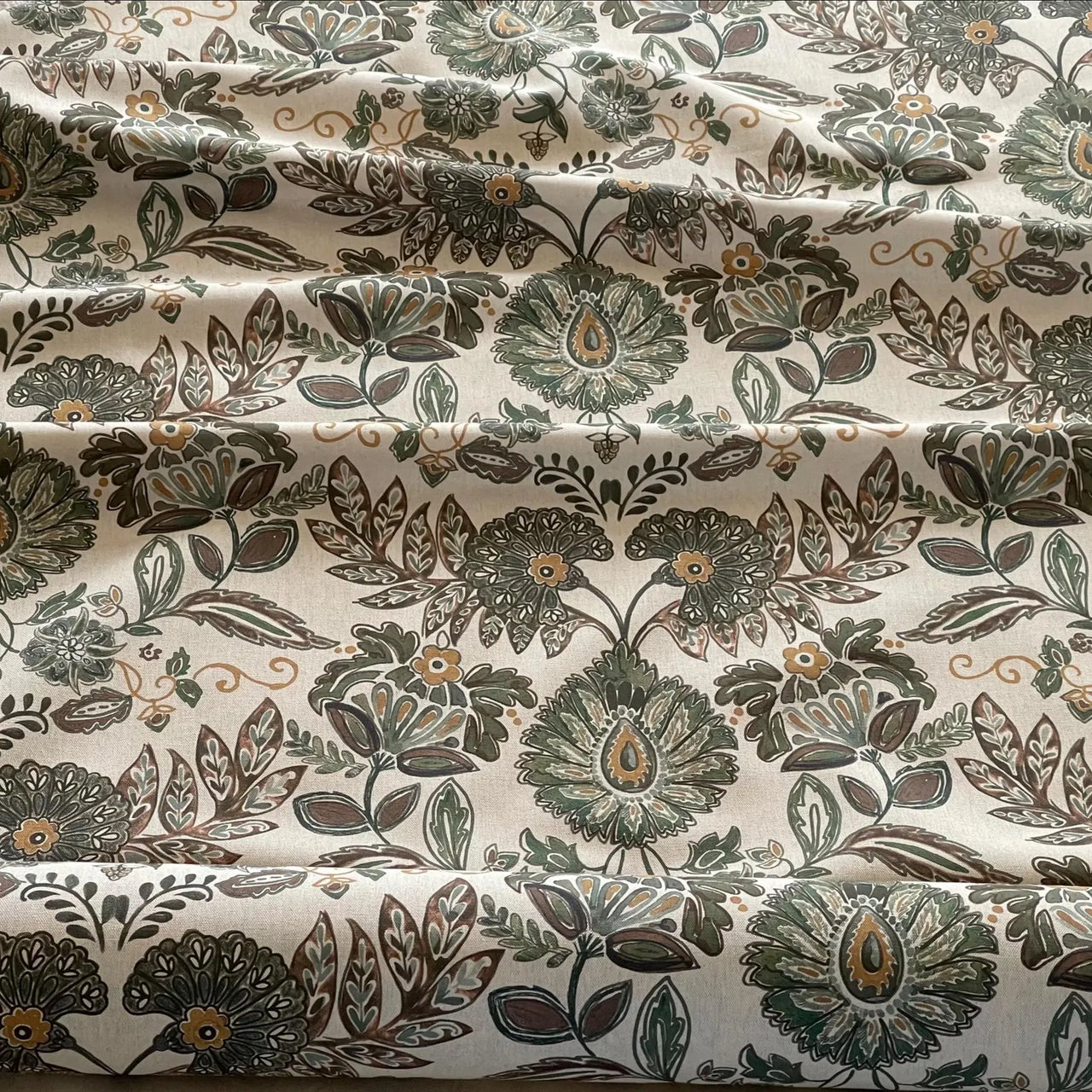 Heritage floral print fabric with soft neutral and green tones