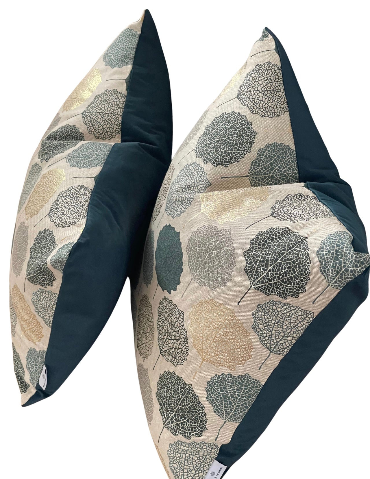 Velvet-backed teal and gold cushion cover.