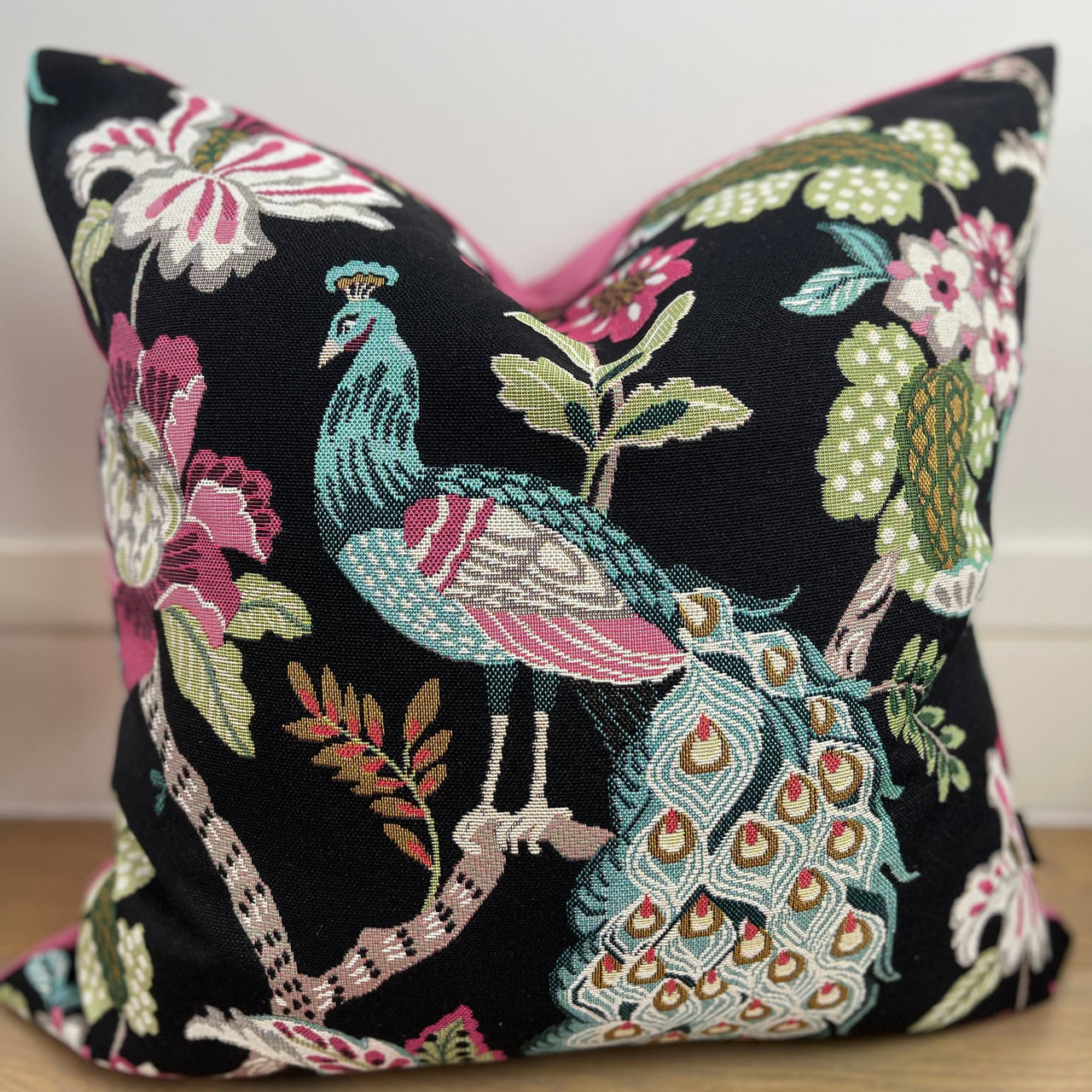 Stylish accent cushion featuring a peacock bird.


