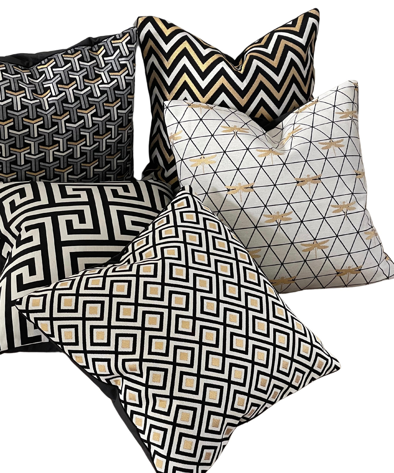 Black and white zig zag pillow with metallic accents.