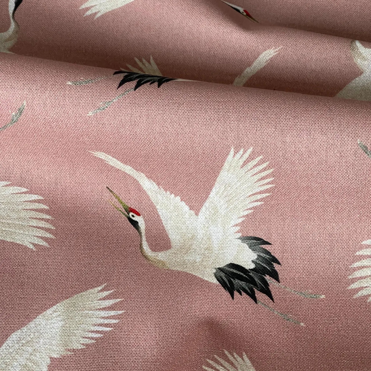 Blush crane fabric ideal for upholstery and soft furnishings.