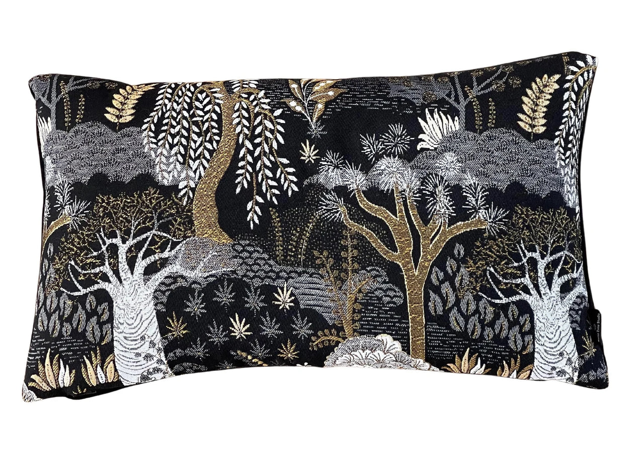 Modern black and gold sofa pillow with nature motif.