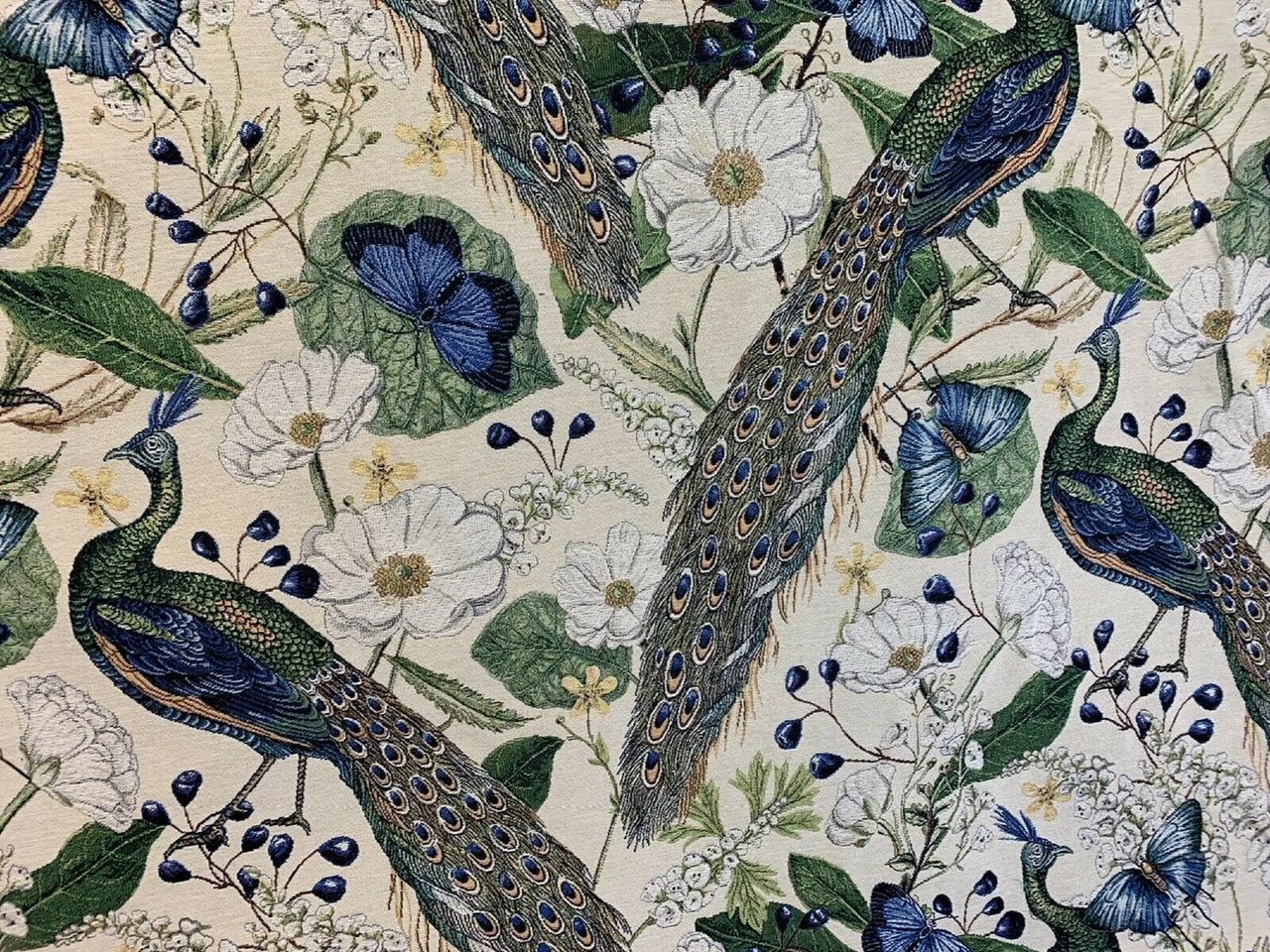 Pattern of peacocks, flowers, and leaves on a beige background