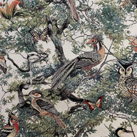 Thumbnail for Luxury woven jacquard fabric with woodland birds perched on branches.