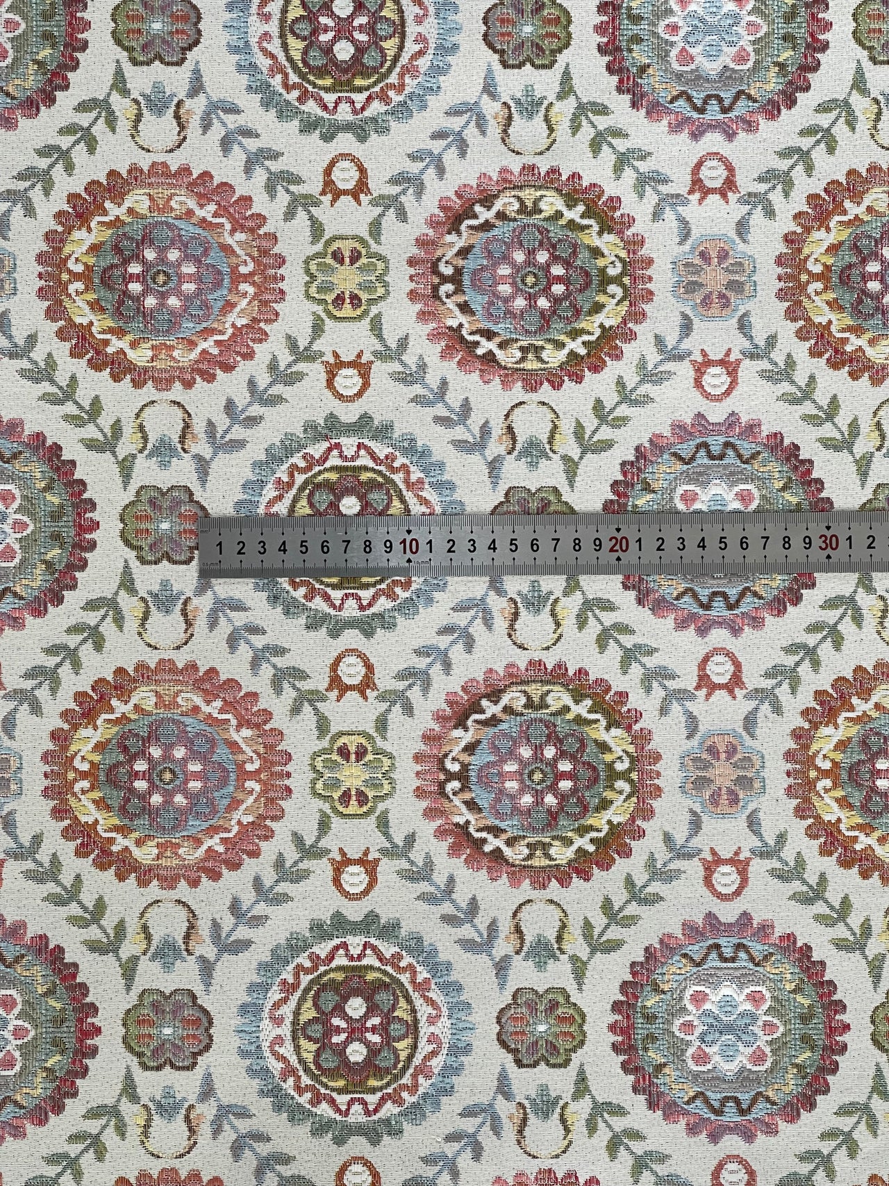Multicolor floral textile with folk motifs