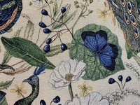 Thumbnail for Embroidered design featuring peacocks, butterflies, and flowers on a beige background