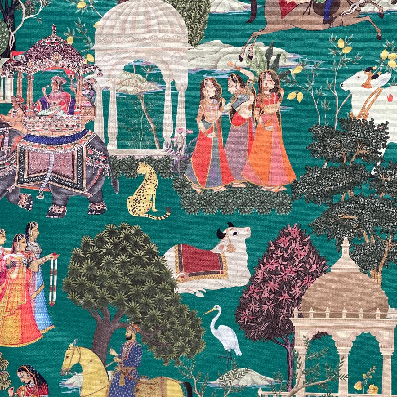 Close-up of Regalia green fabric showing vibrant Indian royal scene, perfect for custom curtains or upholstery projects.