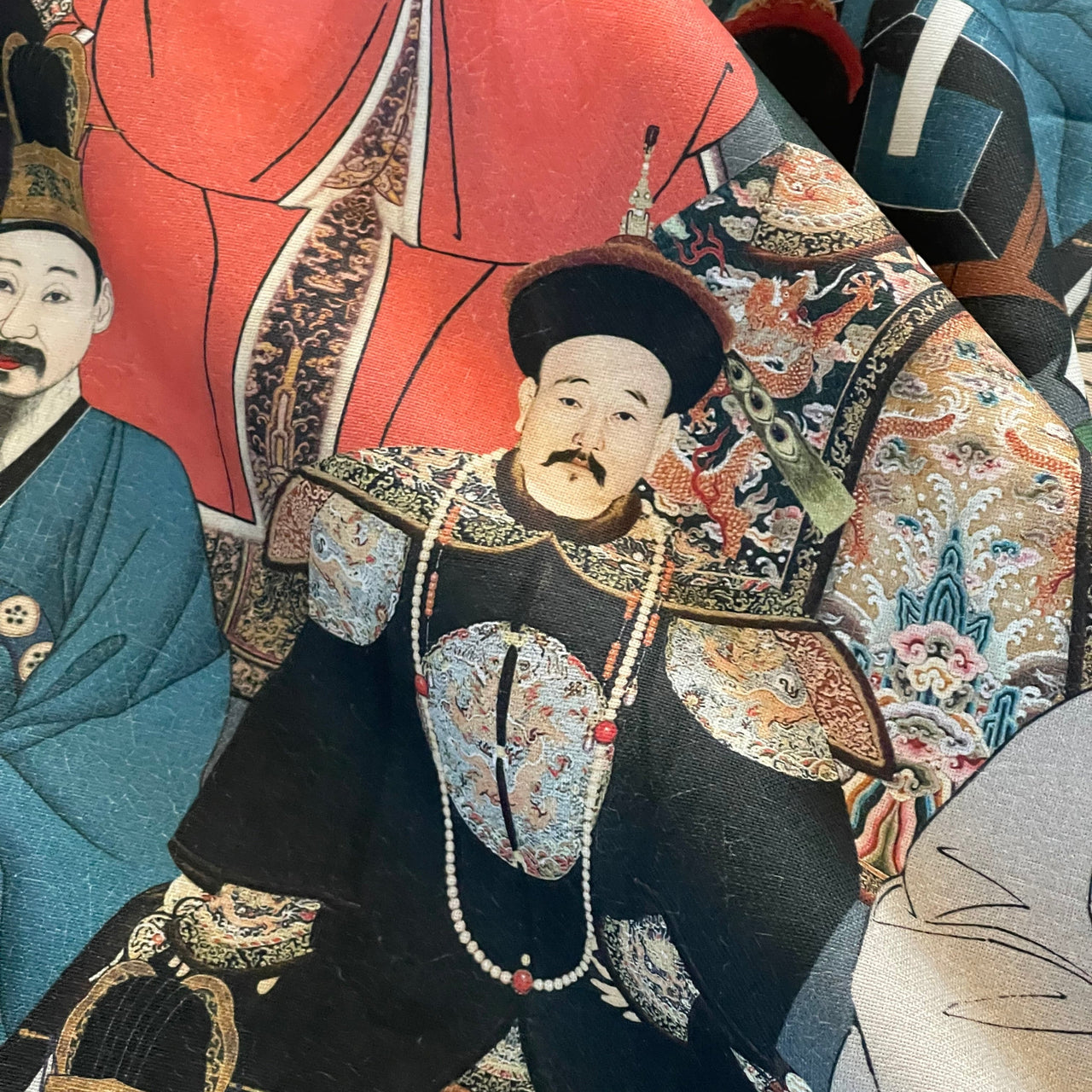 Traditional Chinese attire with intricate patterns and a prominent figure in the foreground.