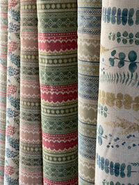 Thumbnail for Collection of fabric swatches with various patterns and colors.