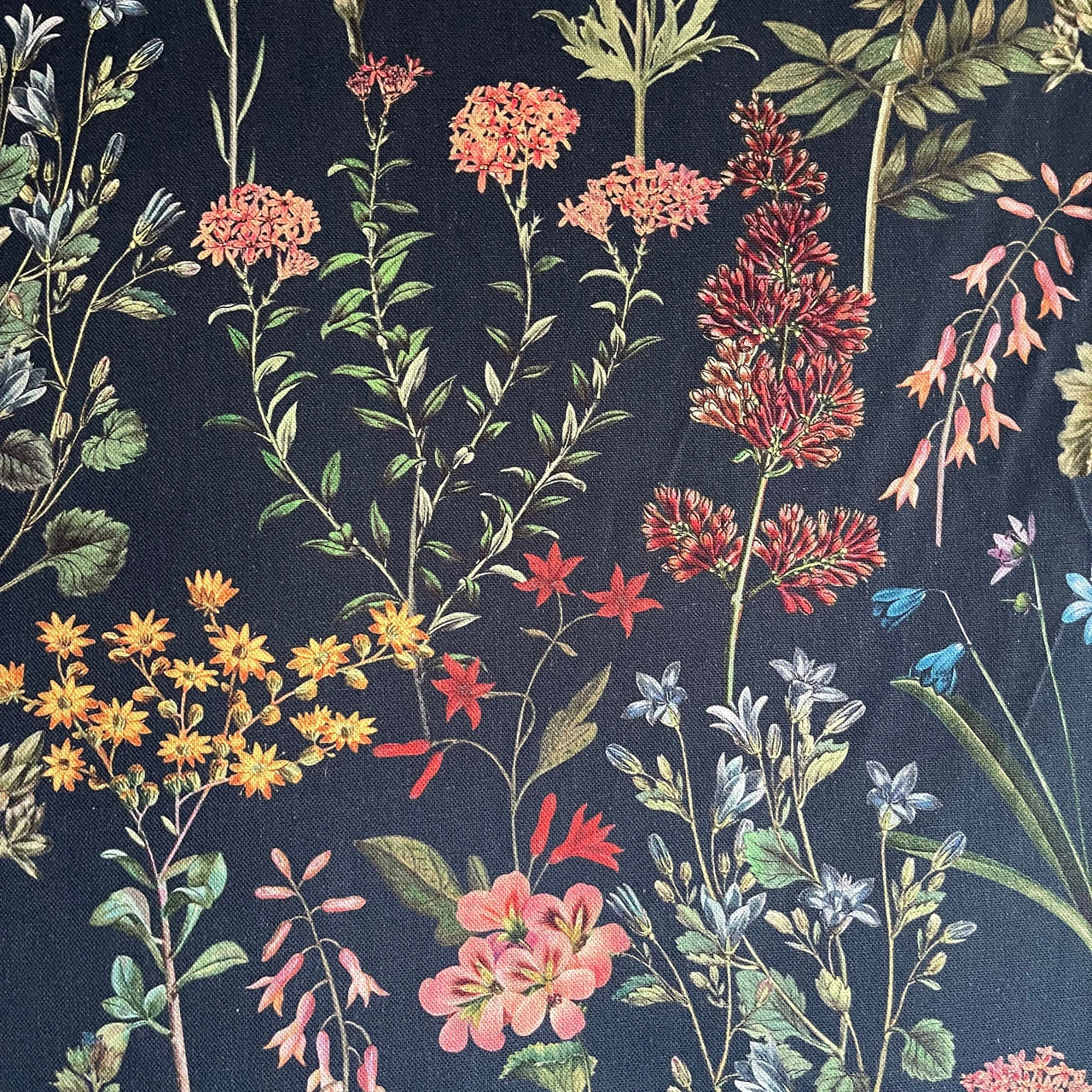 Botanical pattern with flowers and leaves on a dark background