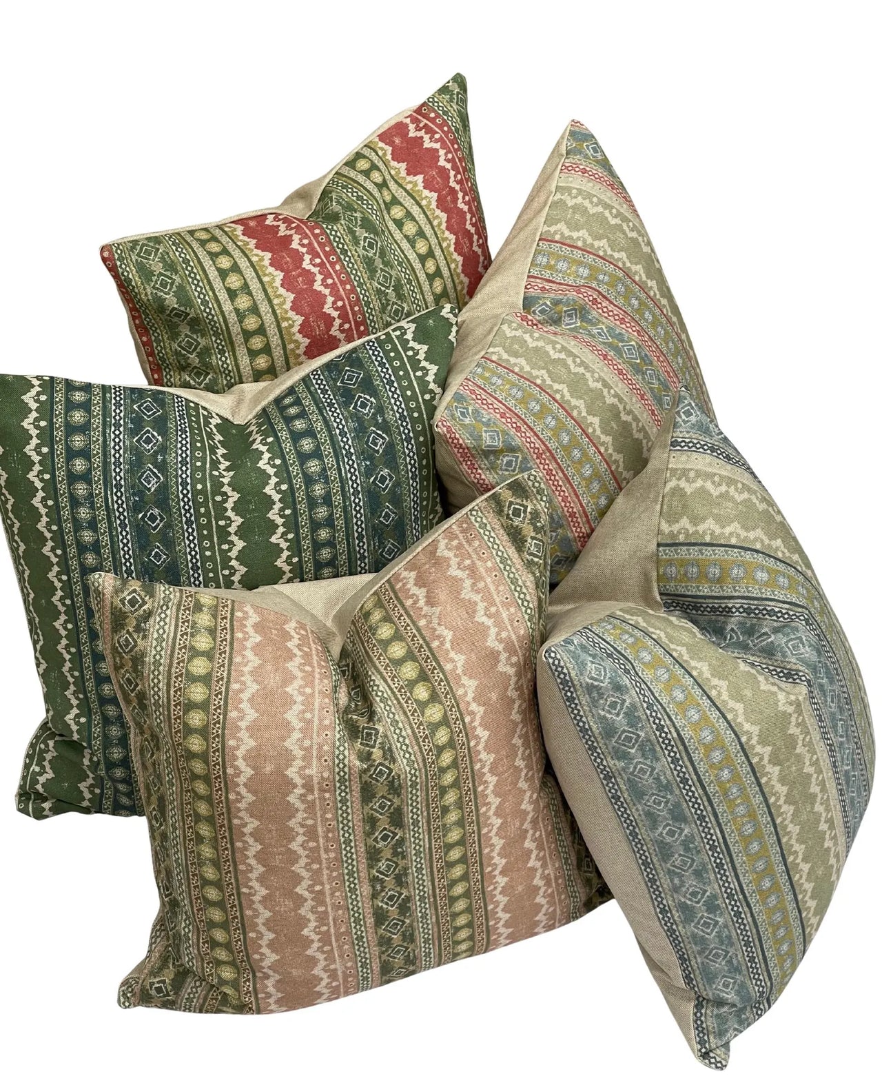 Set of patterned pillows in various colors on a white background