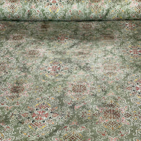 Thumbnail for Roll of patterned fabric with intricate designs on a green background