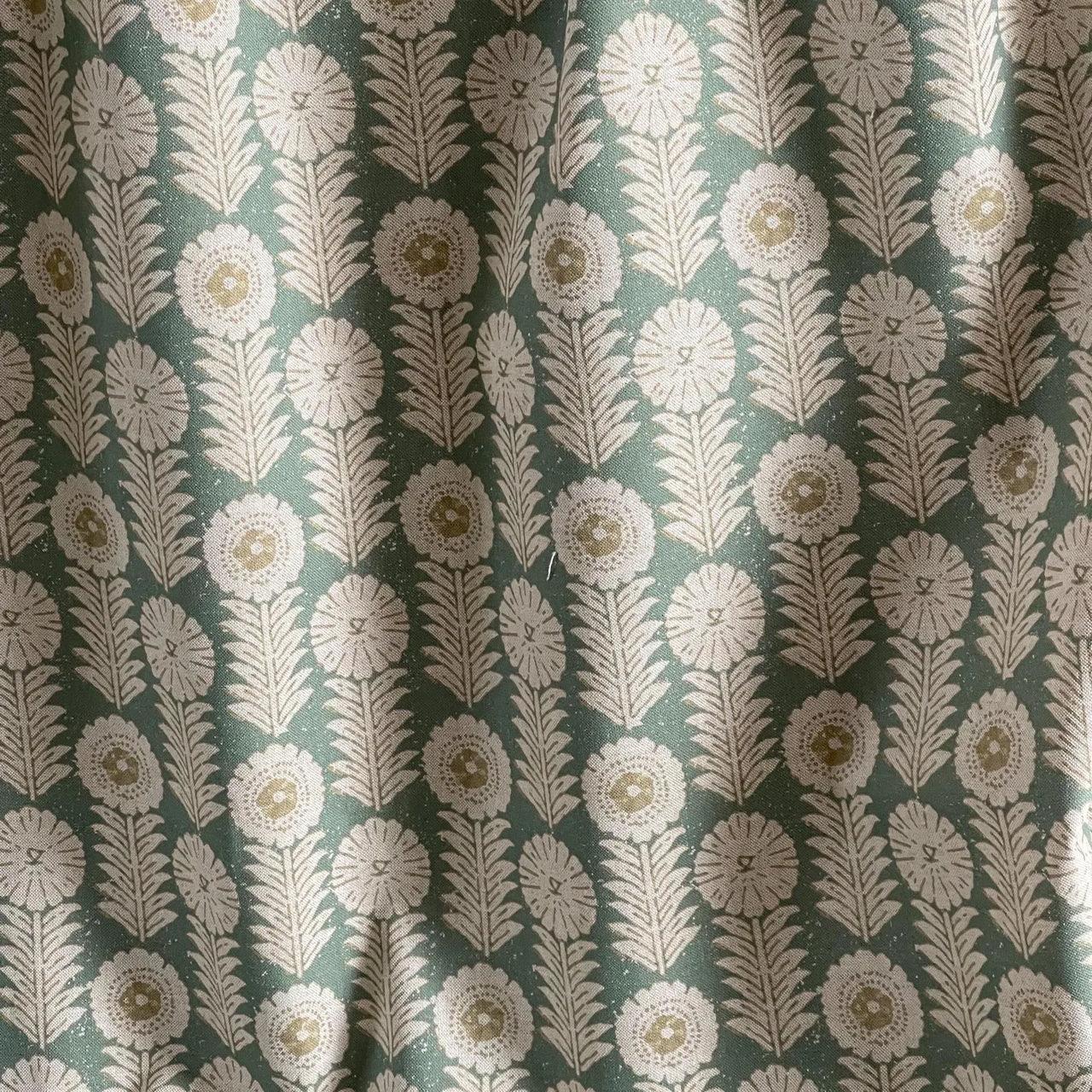 Apple green floral upholstery fabric with linen texture finish