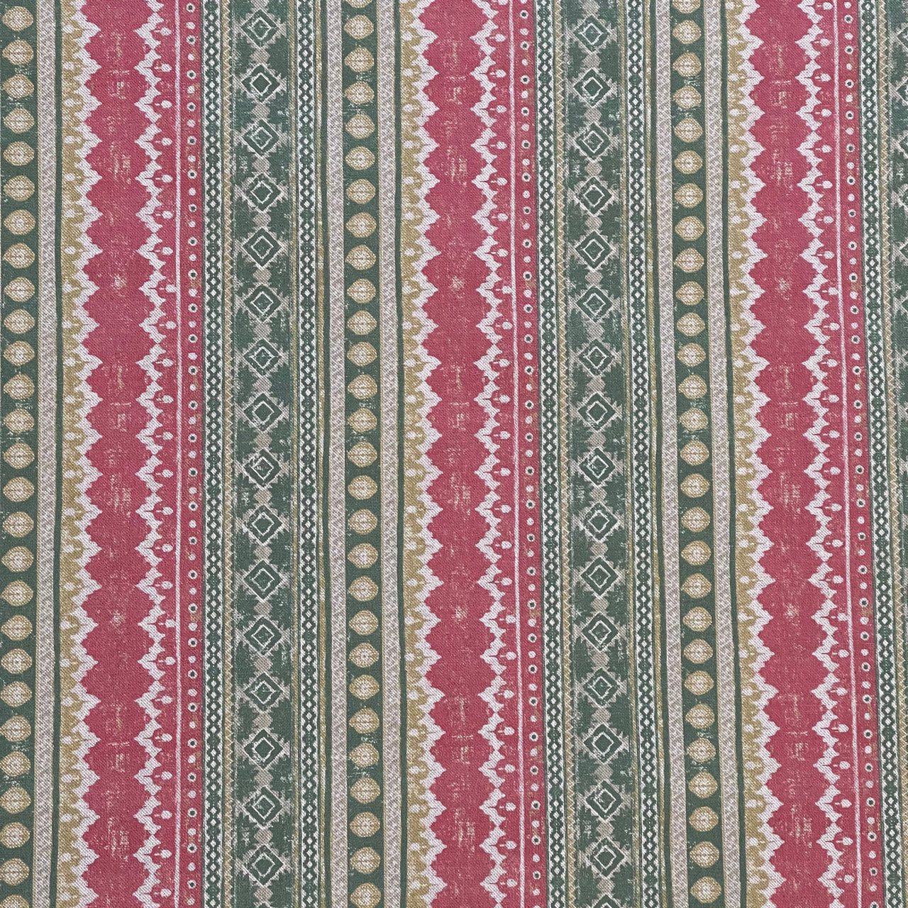 Patterned fabric with red, green, and beige stripes
