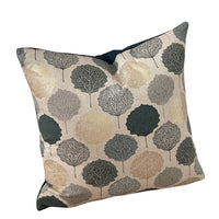 Thumbnail for Geometric cushion with botanical leaf patterns.

