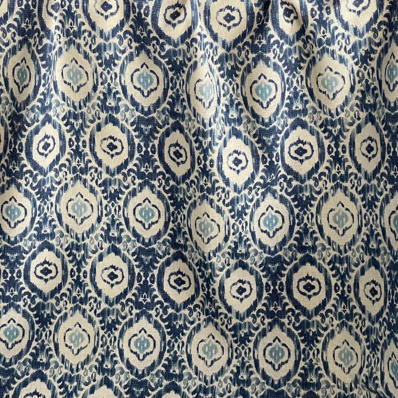 Ikat style curtain fabric in blue tones
