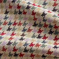Thumbnail for Patterned fabric with red, black, and beige shapes on a textured background