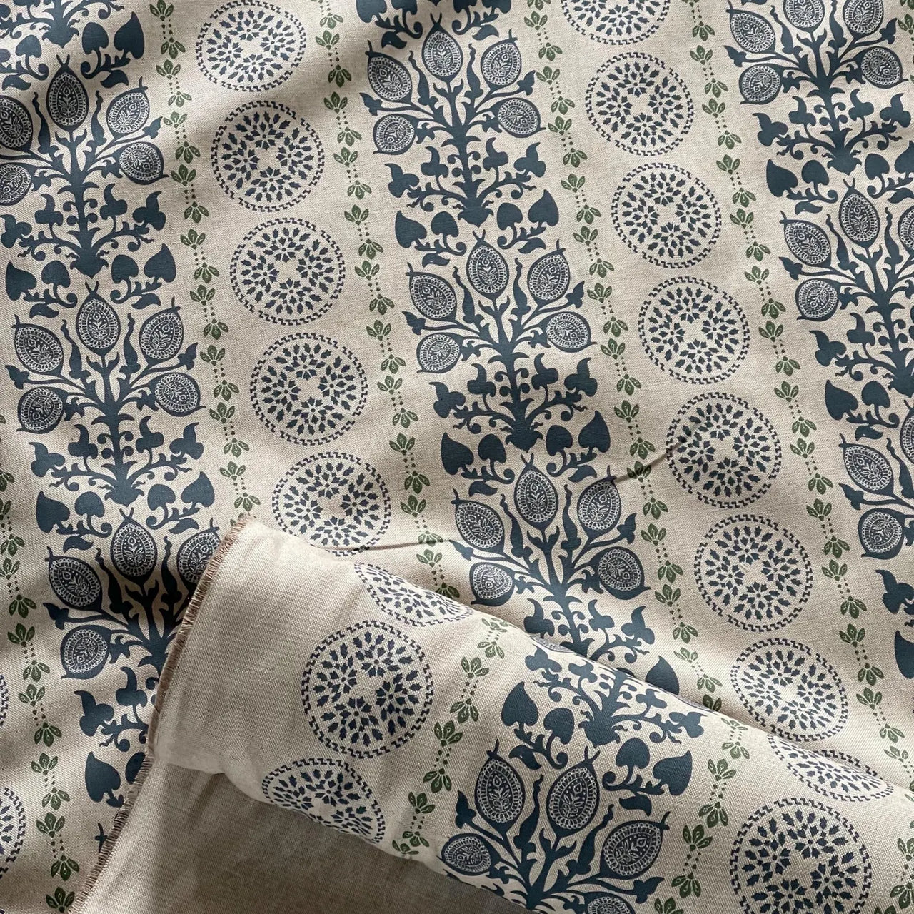 Navy curtain fabric with vertical botanical stripe and medallion motif design